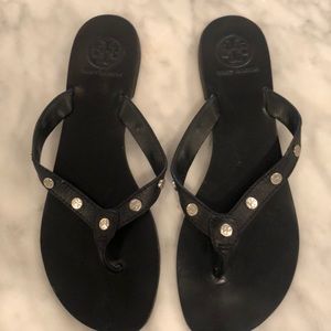 Black leather Tory Burch flip flops w/ silver logo